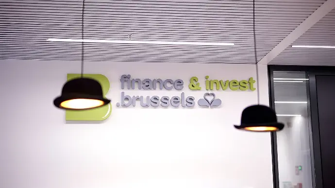 finance and invest brussels logo on wall