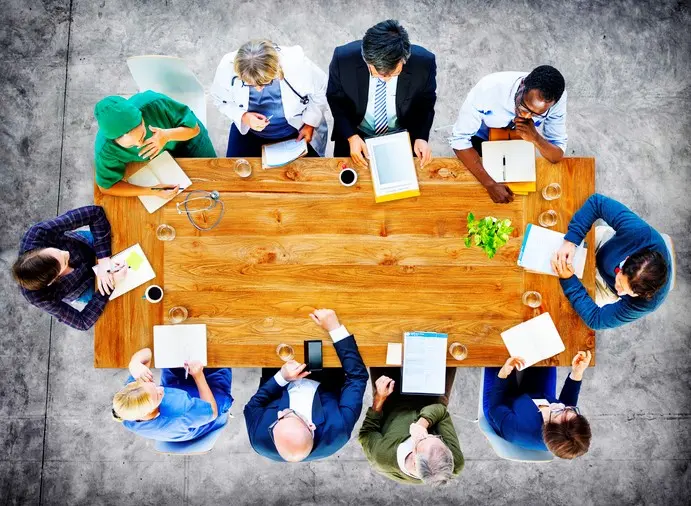 board meeting round a table from above